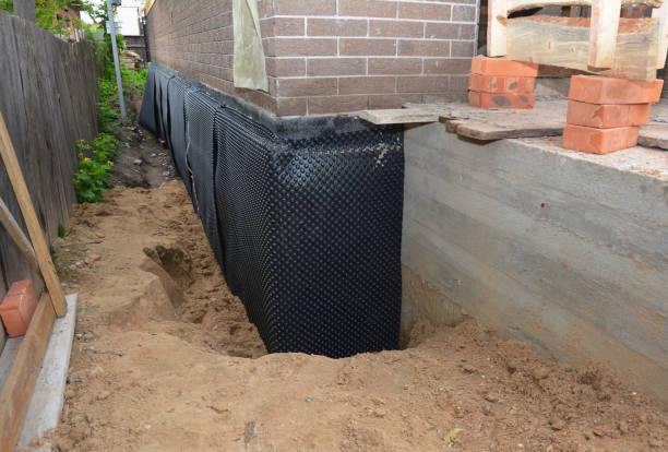 Happy homeowners after waterproofing job in Vincent